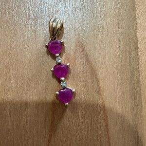 10 karat gold, ruby, and diamond pendant